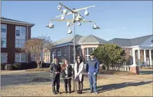  ?? Shorter University, File ?? From left, Shorter University Assistant Professor of Physics Qiang Lu and students Courtney Knight, Jessieca Hannah and J.J. Gilbert stand beneath a rack of purple martin nesting gourds they helped install in Cooper Courtyard in this 2015 file photo.