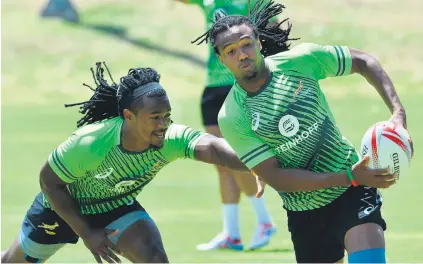 ?? Picture: Gallo Images ?? EAT MY DUST. Cecil Afrika beats Blitzboks team-mate Branco du Preez during a training session at Green Point Track in Cape Town yesterday.