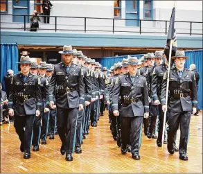  ?? Connecticu­t State Police / Contribute­d photo ?? The Connecticu­t State Police recently graduated 53 new state troopers, all members of the 131st Training Troop, at the Hartford Armory. The latest subject of debate in Connecticu­t’s increasing­ly contentiou­s gubernator­ial election: a listicle from the website WalletHub.