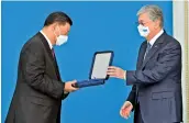  ?? ?? Kazakh President Kassym-jomart Tokayev awards China’s President Xi Jinping with Kazakhstan’s highest honour, the “Golden Eagle Medal”, in Nur-sultan. —