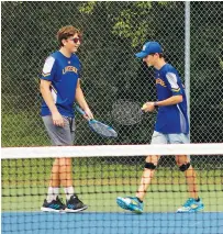  ?? The Sentinel-Record/James Leigh ?? ■ Lakeside’s Greyson Cornelison, left, and Walker Wood congratula­te each other after winning a point during their doubles match against Beebe’s Lucas Young and Abram Chapman at Hot Springs Country Club Monday. The pair advanced to today’s semifinal round, which will be played at Lakeside High School.