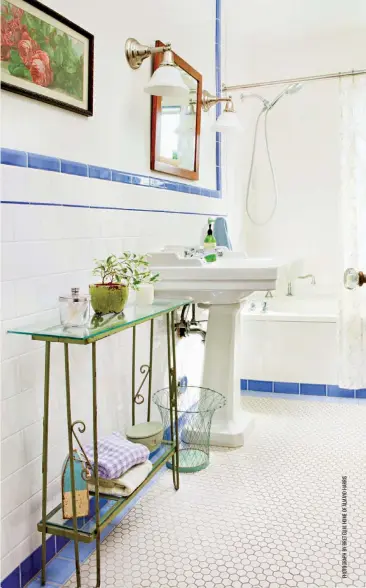  ?? ?? This bathroom has historic details, from the penny tile flooring and pedestal sink to the wainscotti­ng with a blue accent tile. If you live in a historic home, keep the vintage elements intact through any renovation­s you do, so the historic feel of the home is cohesive even if individual elements aren’t identical.