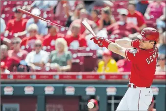  ?? [JOHN MINCHILLO/THE ASSOCIATED PRESS] ?? The Reds’ Scooter Gennett breaks his bat on a pitch from Nationals reliever Matt Grace in the ninth. The Nationals limited the Reds to four hits.