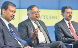  ?? HT/FILE ?? From left: Ajoyendra Mukherjee, global head, HR, TCS; N Chandrasek­aran, chairman, Tata Group and Rajesh Gopinathan, CEO and MD, TCS