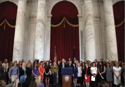  ?? JACQUELYN MARTIN — THE ASSOCIATED PRESS ?? Sen. Jerry Moran, R-Kan., center left, and Sen. Richard Blumenthal, D-Conn., attend a July 24 news conference with dozens of women and girls who were sexually abused by Larry Nassar, a former doctor for Michigan State University athletics and USA Gymnastics in Washington.