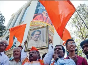  ?? IANS ?? Shiv Sena workers celebrate their performanc­e in the recently concluded BMC polls in Mumbai on Thursday.