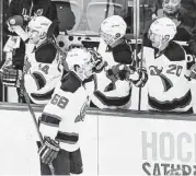  ?? Kathy Kmonicek / Associated Press ?? New Jersey Devils right winger Jaromir Jagr (68) is congratula­ted by Ryan Carter (20) after becoming the seventh player to record 700 NHL goals.