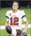  ?? Brett Duke / Associated Press ?? Buccaneers quarterbac­k Tom Brady smiles after Sunday’s win over the Saints.