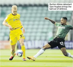  ??  ?? Burton Albion debutant Sam Hughes brings the ball out of defence.