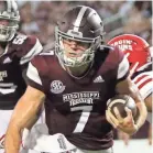  ?? AP ?? Mississipp­i State quarterbac­k Nick Fitzgerald sprints into the end zone for a touchdown between Louisiana-Lafayette defenders Bennie Higgins and Corey Turner.