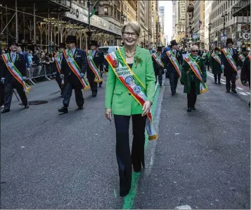  ?? TED SHAFFREY/AP ?? Heineken USA CEO Maggie Timoney (here as grand marshal of the 2024 St. Patrick’s Day Parade in New York) is the first female CEO of a major U.S. beer company. Female executives lost roughly 60 “C-suite” roles last year.
