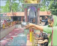  ??  ?? A woman devotee pours milk in the holy pond during the annual Hindu festival at the Kheer Bhawani Temple at Tullamulla in Ganderbal, 28km from Srinagar, on Friday. WASEEM ANDRABI /HT