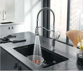  ?? BPT ?? A great way to refresh your kitchen is to paint cabinets a trendy colour, like a dark blue or grey. Replacing the kitchen faucet will also boost style as well as functional­ity.
