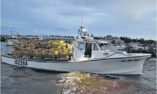  ?? JOURNAL PIONEER FILE PHOTO ?? A fishing boat loaded with gear heads out of West Point Harbour on the opening day of the Lobster Fishing Area 25 fall lobster fishery last August.