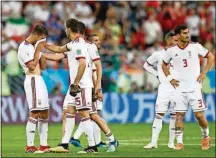  ??  ?? Irainan players react after their draw with Portugal on Monday in Saransk, Russia.