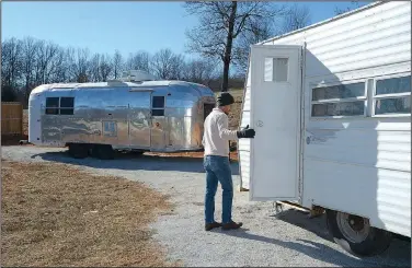  ?? NWA Democrat-Gazette/ANDY SHUPE ?? Zack Kraus leads a tour Thursday of his collection of vintage camper trailers that he and his wife, Laura, plan to open in Prairie Grove pending a decision by the Washington County Planning Board on Thursday.