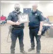  ?? COURTESY PHOTO ?? Farmington Police Chief
Brian Hubbard, right, presents officer Jason Cooper with the Naloxone Life Saving Award during the City Council’s April 12 meeting.