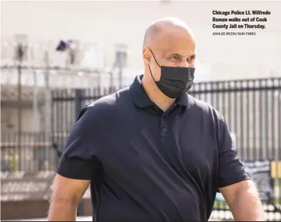  ?? ASHLEE REZIN/SUN-TIMES ?? Chicago Police Lt. Wilfredo Roman walks out of Cook County Jail on Thursday.