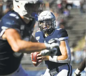  ?? Stephen Dunn / Associated Press ?? UConn quarterbac­k Jack Zergiotis sets to pass during the second half of an NCAA game against Houston on Saturday in East Hartford.