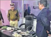  ??  ?? Commission­er of police (Faridabad) KK Rao with the recovered weapons that include 11 imported automatic pistols. SOURCED