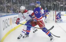  ?? BRUCE BENNETT/GETTY IMAGES ?? Ryan McDonagh, right, of the Rangers pushes Max Pacioretty of the Canadiens on Tuesday in New York City.