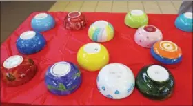  ?? CHRIS BARBER — DIGITAL FIRST MEDIA ?? Decorated bowls were on display for pickup and viewing by others.