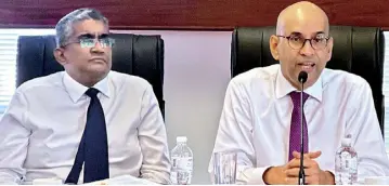  ?? ?? From left : SEC Director General Chinthaka Mendis and Chairman Faizal Salieh