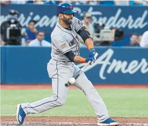  ?? STEVE RUSSELL/TORONTO STAR ?? New York Mets right fielder Jose Bautista makes contact during fifth-inning action against the Blue Jays Wednesday night at the Rogers Centre. The ex-Jay went 1-for-5 in the Mets’ 6-3 win,