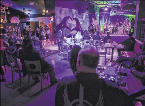  ?? Erik Verduzco Las Vegas Review-Journal @Erik_Verduzco ?? Heartbreak­ers entertain the crowd inside the newly opened Rockstar Bar at the Las Vegas Golf Center.