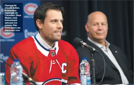  ?? PHOTO AGENCE QMI, SÉBASTIEN ST-JEAN ?? Flanqué de Claude Julien, le nouveau capitaine du Canadien, Shea Weber, s’est brièvement adressé à la presse, hier.