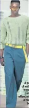  ??  ?? A pair of widelegged pants offset with a neon belt