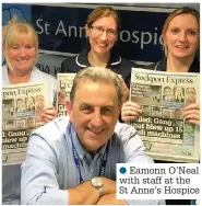  ??  ?? ●●Eamonn O’Neal with staff at the St Anne’s Hospice