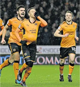  ??  ?? Having a ball: Barry Douglas celebrates putting Wolves two goals ahead