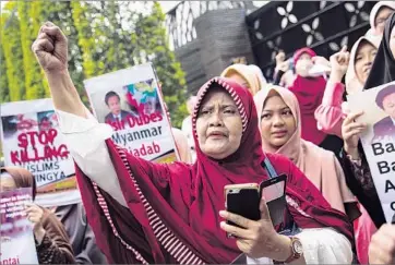  ?? Ed Wray Getty Images ?? IN JAKARTA, Indonesia, women take part in a protest at the Myanmar Embassy over the brutal military crackdown against Rohingya Muslims. “We are here because of solidarity of Muslims,” one demonstrat­or said.