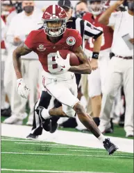  ?? Michael Ainsworth / Associated Press ?? Alabama wide receiver DeVonta Smith runs for a touchdown after a catch against Notre Dame during the Rose Bowl in Arlington, Texas on Friday. Smith won the Heisman Trophy on Tuesday night.