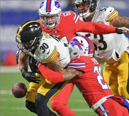  ?? Peter Diana/Post-Gazette ?? Running back James Conner fumbles against the Bills. The Steelers recovered, but the ground game was nonexisten­t.