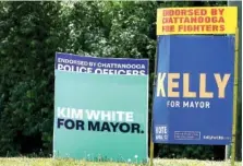  ??  ?? Signs supporting the two mayoral candidates are seen along Amnicola Highway near the Hamilton County Election Commission on Monday.