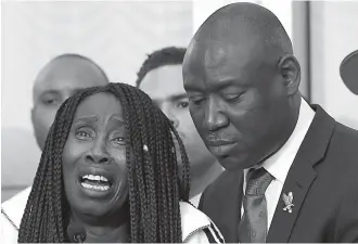  ?? AP Photo/Rich Pedroncell­i, File ?? ■ In this Monday file photo, attorney Benjamin Crump, right, stands alongside Sequita Thompson as she breaks into tears while talking about the fatal police shooting of her grandson Stephon Clark during a news conference in Sacramento, Calif. Over the...