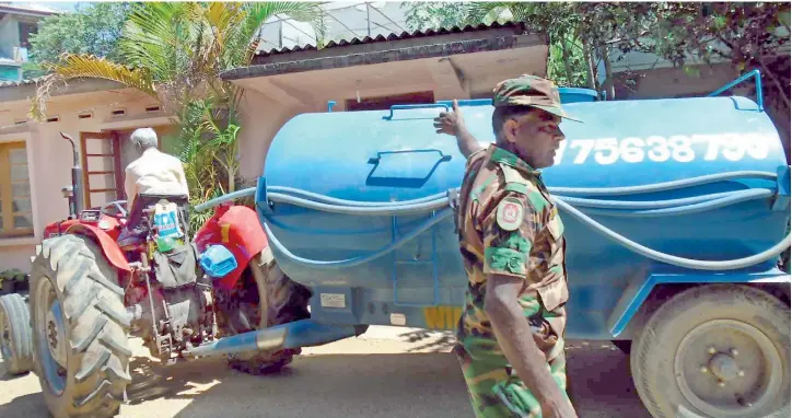  ??  ?? Bowser water only once a week: Residents say the water supplied is not enough even to cook their meals and wash dishes. To take a bath, they go looking for waterfalls in other villages. Pic by W. Rajamanthr­i