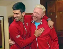  ??  ?? Novak Djokovic and Boris Becker embrace after winning the 2016 French Open.