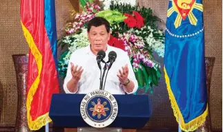  ??  ?? Philippine President Rodrigo Duterte gives a speech during Eid Al-Fitr celebratio­ns at the Malacanang Palace in Manila on Tuesday. (AFP)