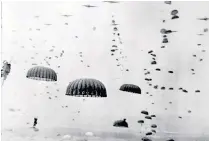  ?? ?? Szmid began his parachute training at the age of 18. Left, paratroope­rs during Operation Market Garden