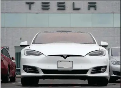  ?? (AP/David Zalubowski) ?? Tesla vehicles are displayed at a company facility in Littleton, Colo., in May.