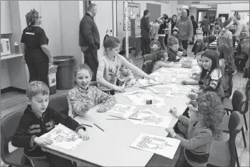  ?? SUBMITTED ?? Children enjoy the crafts at colouring tables in the gym.