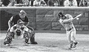  ?? Carolyn Kaster / Associated Press ?? Jose Altuve, whose first-inning strikeout and third-inning popup left him 0-for-10 in All-Star competitio­n, lines a fifth-inning single off the Phillies’ Aaron Nola on Tuesday night at Nationals Park.