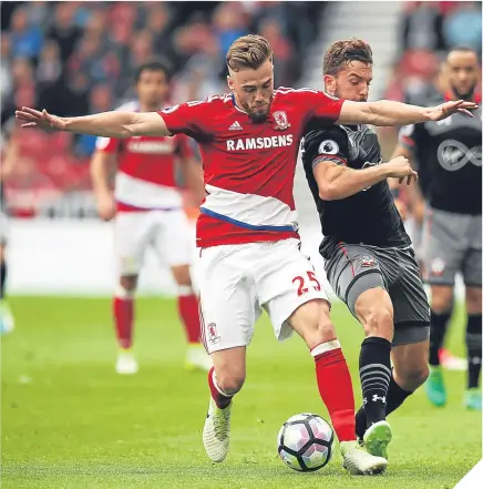  ??  ?? ■ Boro’s Calum Chambers and Southampto­n striker Jay Rodriguez challenge for possession.