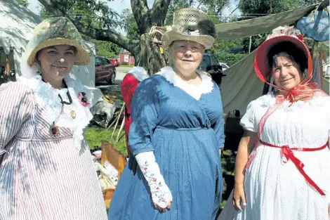  ?? PHOTOS BY KRIS DUBE/ SPECIAL TO POSTMEDIA NEWS ?? Above: Dawn Luckham, Charlene Roberts and Lisa Gilbert at the Siege Weekend in Fort Erie. Right: Terry Sanderson, an Oakville resident playing the role of a leather worker at the Old Fort on Sunday.