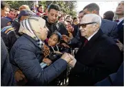  ?? SLIM ABID / TUNISIAN PRESIDENCY ?? Tunisian President Beji Caid Essebsi greets bystanders Sunday in Tunis. Tunisia was marking seven years since its autocratic ruler fled into exile.