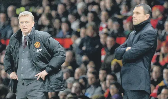  ??  ?? David Moyes looks on during Manchester United’s Capital One Cup semi-final clash against Gus Poyet’s Sunderland in 2014