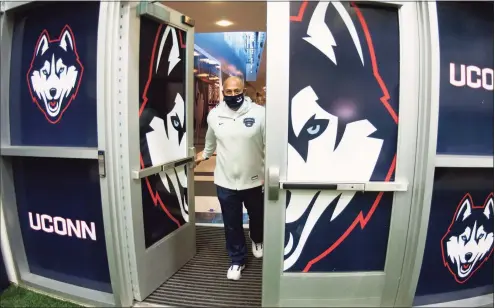  ?? Christian Abraham / Hearst Connecticu­t Media file photo ?? UConn Athletic Director David Benedict enters the Mark R. Shenkman Training Center on the campus in Storrs in March.